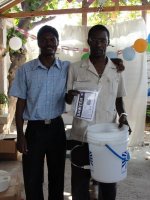 Pastor Pierre Banes Laurore, the Kids' EE Haiti Director seen here in YWAM in Gonaive documenting the Sawyer PointONE water filter distribution.