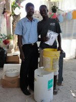 Pastor Pierre Banes Laurore, the Kids' EE Haiti Director seen here in YWAM in Gonaive documenting the Sawyer PointONE water filter distribution.