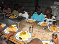 HaitiOne partnering with United Caribbean Trust feeding children in Haiti physically and Spiritually