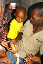 Haiti Church of God feeding the children at the Kids EE Training Summer Camp