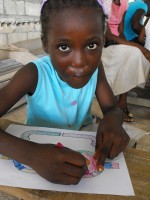 the children receiving their Make Jesus Smile shoeboxes as Jenny returned to Haiti in January to distribute the 2,500 boxes packed by the children of Barbados.