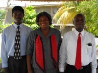 Seen here Pastor Williams and his wife with Pastor Banes the Kids' EE Haiti coordinator outside the church. .