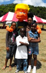 Max seen here with the children of Gordon Greenidge school