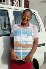 Dolly receiving her Love Packages donated to Mount Zion Missin International church