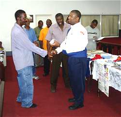 Brother Earl Clarke of the Fitts Village Church receiving a special prize from Rev Phillips for being the first Centurion 