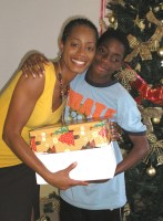Seen here the children receiving their Make Jesus Smile Christmas shoebox gifts packed by the children of Barbados.