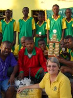 Football the champions in Hati with their trophy donated by Sewing World Barbados