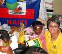 Jenny Tryhane, Founder of United Caribbean Trust giving out the first shoeboxes only hours after the container had been released.