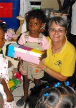 Jenny Tryhane, Founder of United Caribbean Trust giving out the first shoeboxes only hours after the container had been released.