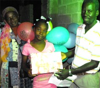 YWAM Director Muala Jean-Marie and his wife assisting with the distribution.