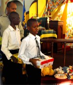 Seen here at their Harvest Festival bearing their Make Jesus Smile shoebox gifts as they brought them to the alter to 'Sow a seed of Love' for Haiti.