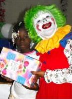 Annie the clown distributing Make Jesus Smile shoeboxes