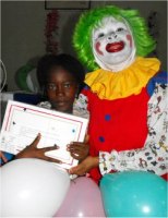 Annie the clown distributing Make Jesus Smile shoeboxes