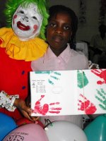 Annie the clown distributing Make Jesus Smile shoeboxes