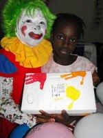 Annie the clown distributing Make Jesus Smile shoeboxes