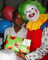 Annie the clown distributing Make Jesus Smile shoeboxes