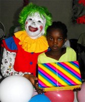 Annie the clown distributing Make Jesus Smile shoeboxes