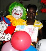 Annie the clown distributing Make Jesus Smile shoeboxes