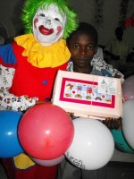 Annie the clown distributing Make Jesus Smile shoeboxes