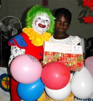 Annie the clown distributing Make Jesus Smile shoeboxes