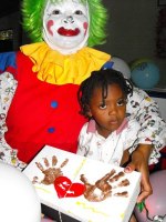 Annie the clown distributing Make Jesus Smile shoeboxes