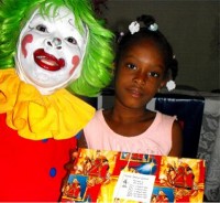 Annie the clown distributing Make Jesus Smile shoeboxes