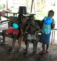 The children enjoying the balloons donated by Laurie Dash the Toy Shop in Barbados