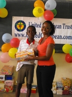 Kathy Ann Sanderford  distributing the Make Jesus Smile shoeboxes in Brokoponda