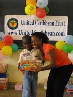 Kathy Ann Sanderford  distributing the Make Jesus Smile shoeboxes in Brokoponda