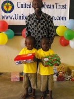 Pastor distributing the Make Jesus Smile shoeboxes in Brokoponda