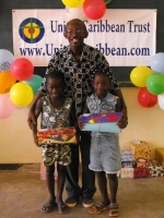 Pastor distributing the Make Jesus Smile shoeboxes in Brokoponda