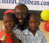 Pastor distributing the Make Jesus Smile shoeboxes in Brokoponda