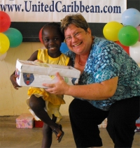 Kim Smith distributing the Make Jesus Smile shoeboxes in Brokoponda