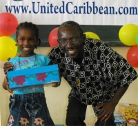 Pastor distributing the Make Jesus Smile shoeboxes in Brokoponda