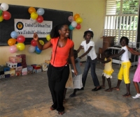 Kathy Ann Sanderford  distributing the Make Jesus Smile shoeboxes in Brokoponda