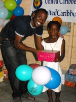 Imran Richards representing the Wesleyan Holiness church in Barbados seen here distributing the Make Jesus Smile shoeboxes.