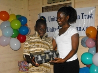 Kathy Ann Sanderford from New Dimensions Ministry in Barbados seen here distributing the Make Jesus Smile shoeboxes.