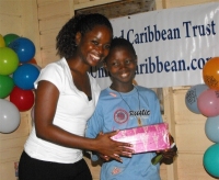 Kathy Ann Sanderford from New Dimensions Ministry in Barbados seen here distributing the Make Jesus Smile shoeboxes.