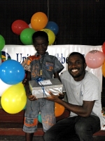 Imran Richards representing the Wesleyan Holiness church in Barbados seen here distributing the Make Jesus Smile shoeboxes.