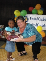 Kim Smith from Restoration Ministries in Barbados distributing the Make Jesus Smile shoeboxes to the Maroons in Victoria.