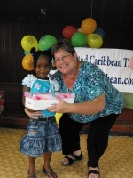 Kim Smith from Restoration Ministries in Barbados distributing the Make Jesus Smile shoeboxes to the Maroons in Victoria.