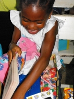 Kathy Ann Sanderford from New Dimensions Ministry in Barbados seen here distributing the Make Jesus Smile shoeboxes.