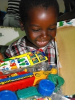 Imran Richards representing the Wesleyan Holiness church in Barbados seen here distributing the Make Jesus Smile shoeboxes.