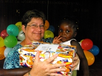 Kim Smith from Restoration Ministries in Barbados distributing the Make Jesus Smile shoeboxes to the Maroons in Victoria.