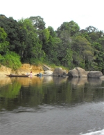 On arrival at Tjaikondre there is always a hive of activity with little scantly clad children fishing and helping their mothers with the washing or diving off the round smooth rocks and generally enjoying the cool water of river-side life.