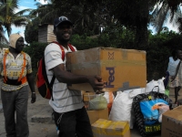 Seen here the Make Jesus Smile shoeboxes being transported up the Suriname River and arriving at Tjaikondre.