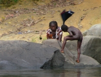 On arrival at Tjaikondre there is always a hive of activity with little scantly clad children fishing and helping their mothers with the washing or diving off the round smooth rocks and generally enjoying the cool water of river-side life.