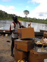 Seen here the Make Jesus Smile shoeboxes being transported up the Suriname River and arriving at Tjaikondre.