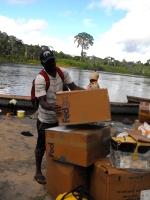 Seen here the Make Jesus Smile shoeboxes being transported up the Suriname River and arriving at Tjaikondre.