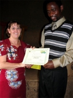 Seen here receiving his KIMI certificate from Pastor Laura in Uganda.